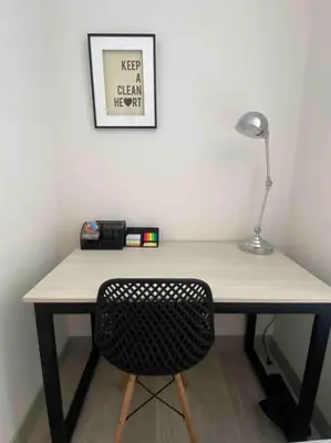 a desk with a lamp and a chair in a room at Lovely Aparment OceanView Barranco1809 in Lima