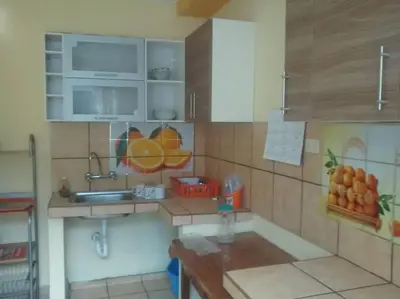 a small kitchen with a sink and a counter top at depacentrohuancayo in Huancayo