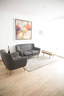 a living room with a couch and a coffee table at Barranco Best Location - Apartment wAC in Lima