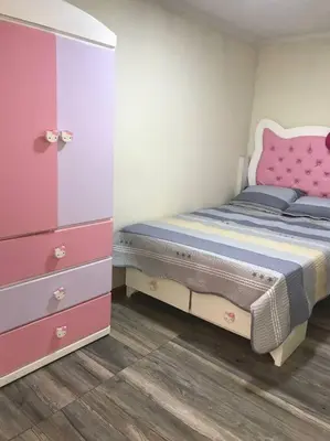 a small bedroom with a bed and a dresser at Hermoso Duplex en Chorrillos in Lima