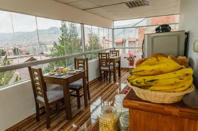 a balcony with a bunch of bananas on a table at Dreams Boutique Hotel Cusco in Cusco