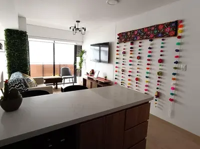 a kitchen with a wall with a bunch of pins at Runawasi Apartments - Killary Miraflores 2BDR in Lima