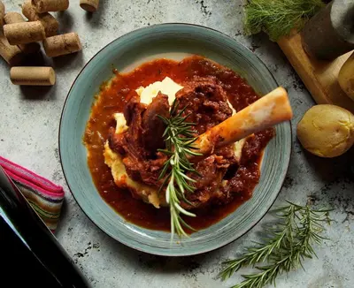 a bowl of stew with a piece of bread in it at Tuki Llajta - Pueblo bonito Lodge in Huancayo