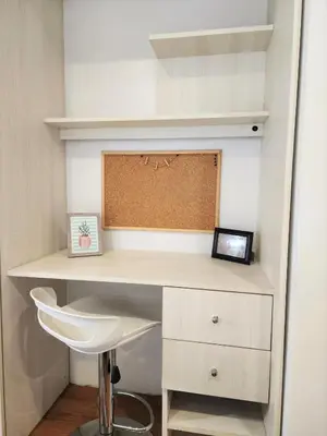 a white desk with a chair in a room at Bright 1BR close to boulevard in Lima