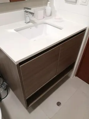 a bathroom sink with a white counter top at EL PRAT Luxury Aparment Lima Peru in Lima