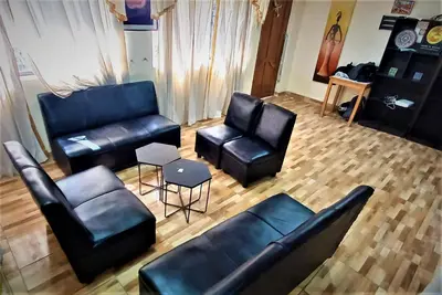 an overhead view of a living room with leather furniture at Carlos Guest House 2 Cusco in Cusco
