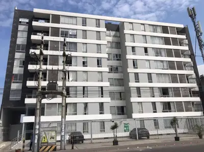 a large white apartment building on a city street at Lindo Departamento en Av. Guardia Civil 861 - Chorrillos in Lima