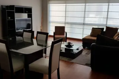 a living room with a glass table and a couch at New and nice apartment Miraflores in Lima
