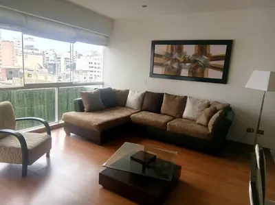 a living room with a couch and a table at New and nice apartment Miraflores in Lima