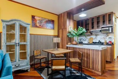 a kitchen with a table and chairs in a room at Lima Virreinal & primer piso muy acogedor in Lima