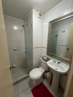 a bathroom with a toilet and a sink and a shower at Lindo y Acogedor Departamento en Lima! in Lima
