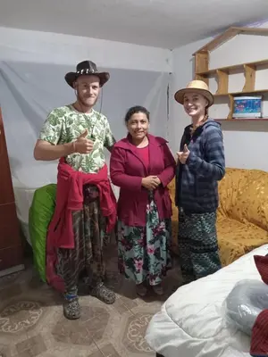 a group of three people standing in a room at Posada Ternura in Lima