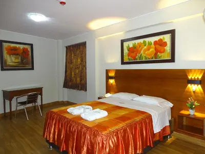a hotel room with a bed with towels on it at Hospedaje Dimar Inn in Lima