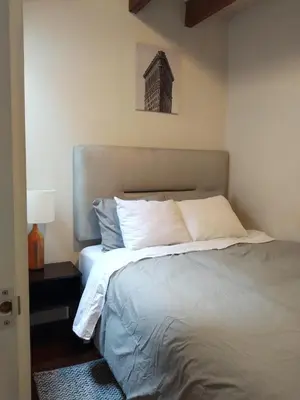 a bedroom with a large bed with white pillows at Centric, private, petfriendly budget apartments in Miraflores in Lima
