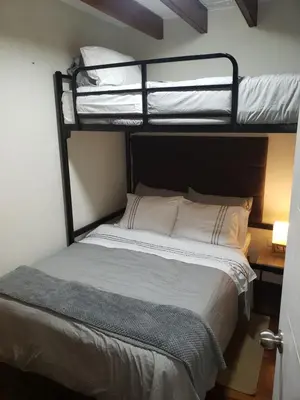 a bedroom with two bunk beds in a room at Centric, private, petfriendly budget apartments in Miraflores in Lima