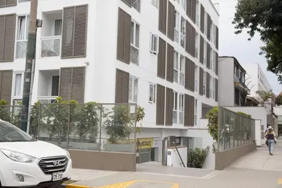 a white car parked in front of a building at Barranco Perfect Location - Apartament in Lima