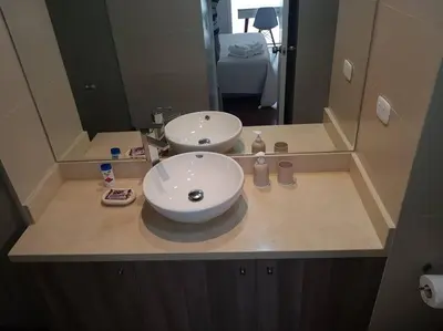 a bathroom counter with a sink and a mirror at Barranco Perfect Location - Apartament in Lima