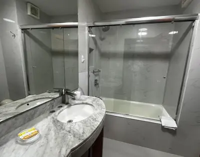 a bathroom with a sink and a shower at San Isidro Olivar 2 bedroom Apartment in Lima