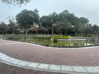 a pond in the middle of a park at San Isidro Olivar 2 bedroom Apartment in Lima