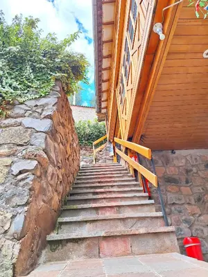 a set of stairs leading up to a building at Andenes del Sol in Cusco