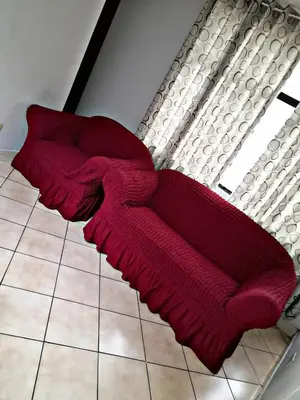 a red blanket sitting on the floor next to a window at LAS ARTES INN in Lima