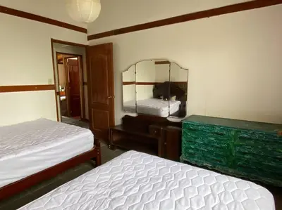 a bedroom with two beds and a mirror at Casa de campo con piscina en Asia in Asia