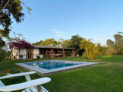 a swimming pool in the middle of a yard at Casa de campo con piscina en Asia in Asia