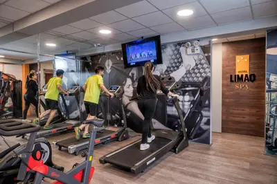 a group of people on treadmills in a gym at LimaQ Hotel in Lima