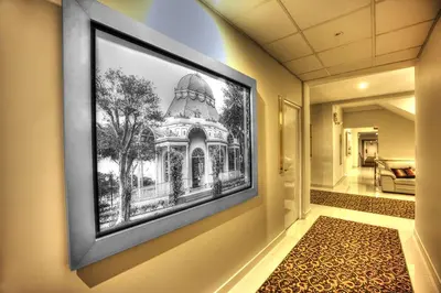 a framed picture of a building on a wall at LimaQ Hotel in Lima