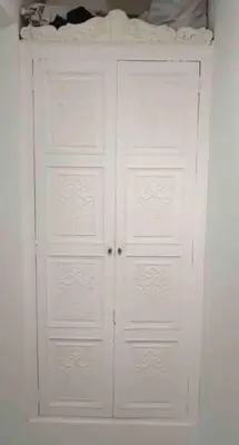 a white closet with two doors in a room at A beautiful place in the heart of Miraflores in Lima