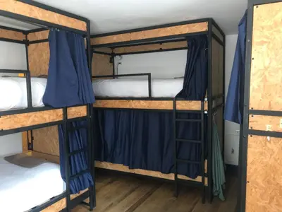 a couple of bunk beds in a room at Saqray Hostel in Cusco