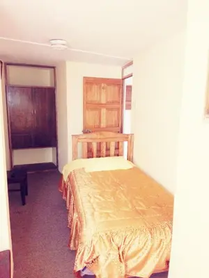 a bedroom with a bed in a room at Euro Hostal in Cusco