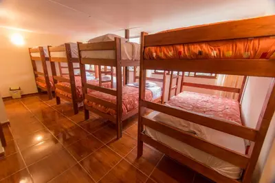 a group of bunk beds in a room at Casa Machu Picchu Hostel in Machu Picchu