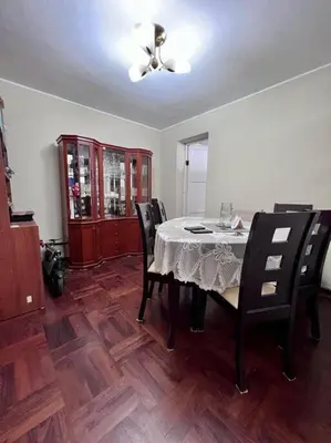 a dining room with a table and black chairs at Siempre Listo in Lima