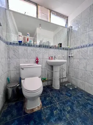 a bathroom with a toilet and a sink at Siempre Listo in Lima