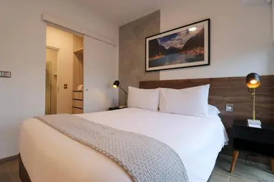 a bedroom with a large white bed in a room at The Modern by Wynwood House in Lima