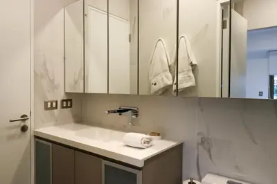 a bathroom with a sink and a mirror at The Modern by Wynwood House in Lima