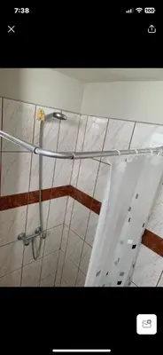 a shower stall in a bathroom with a metal rack at Miraflores Moonlight in Lima