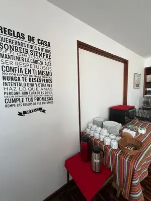 a room with a table with cups and plates on it at Harmony Inn Miraflores in Lima