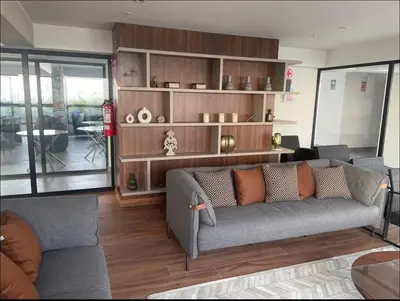 a living room with a gray couch and wooden shelves at Apartament Social Tree 907 in Lima