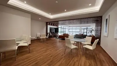 a living room with tables and chairs and a couch at Apartament Social Tree 907 in Lima