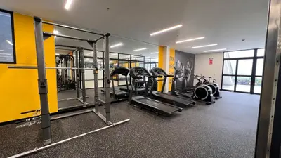 a gym with several treadmills and machines at Apartament Social Tree 907 in Lima