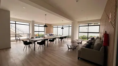 a living room with a couch and tables and windows at Apartament Social Tree 907 in Lima