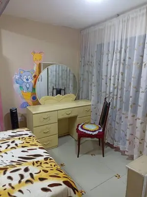 a bedroom with a dressing table and a mirror at Mi Casa Bonita con baño privado y ducha caliente in Lima