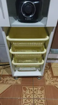 a refrigerator with a microwave on top of it at Mi Casa Bonita con baño privado y ducha caliente in Lima