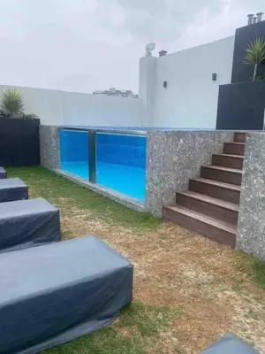 a house with a swimming pool and stairs next to it at SWEET HOME MIRAFLORES in Lima