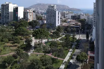 a view of a city with buildings and a park at Barranco landscape suite boardwalk in Lima