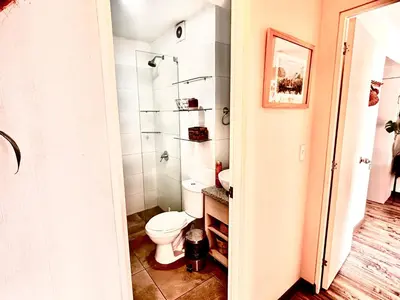 a bathroom with a toilet and a sink at departamento encantador céntrico con balcon in Lima