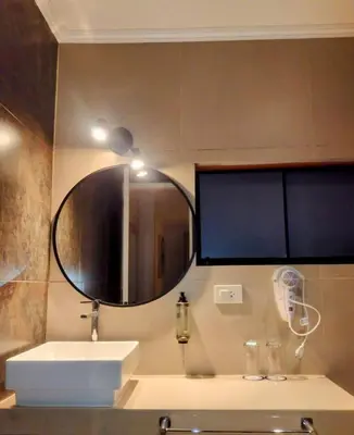 a bathroom with a sink and a mirror at Blu Hotel Boutique in Lima