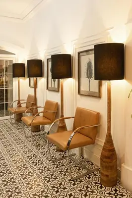 a waiting room with a row of chairs and lamps at Blu Hotel Boutique in Lima